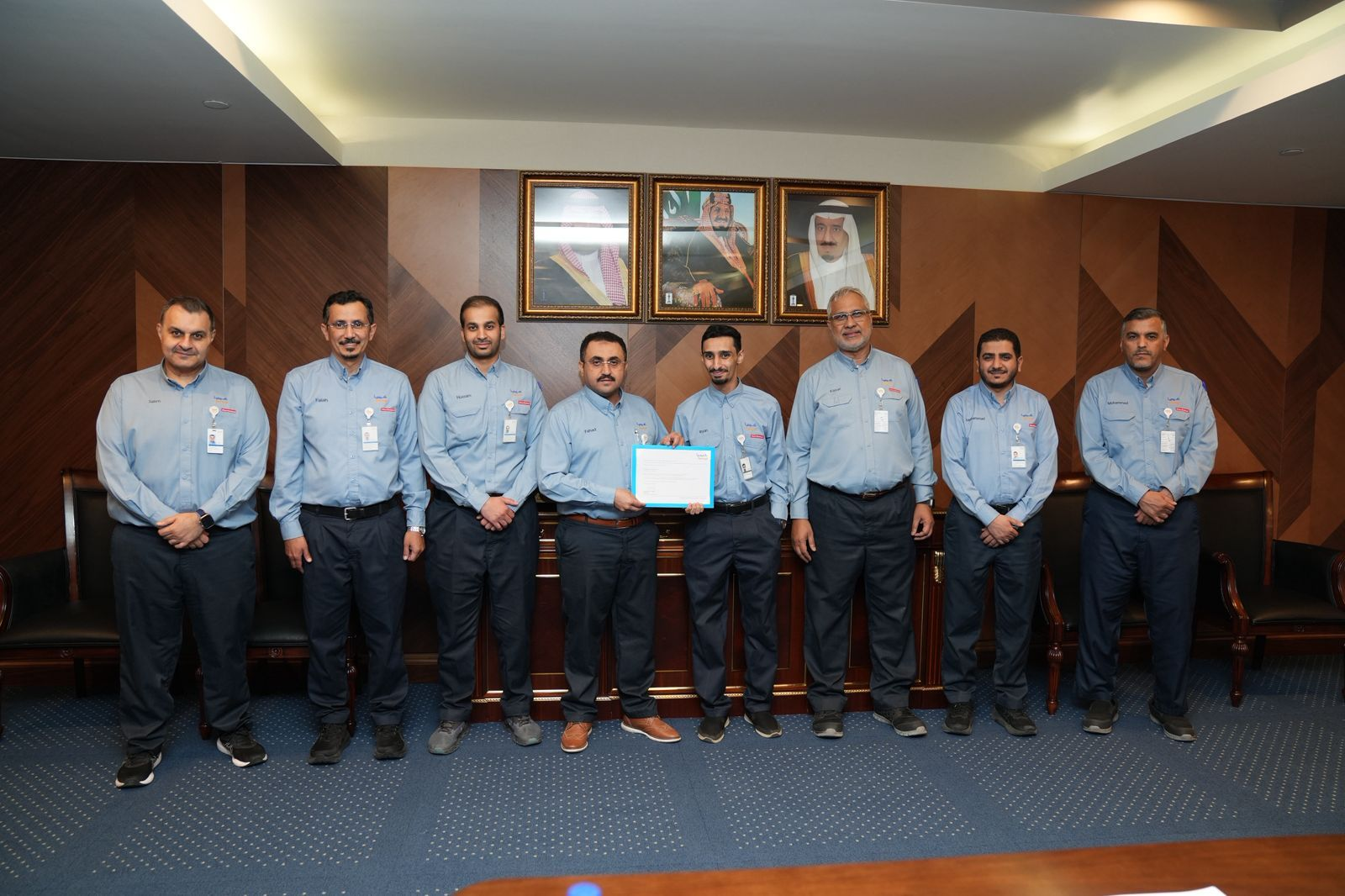 Ryan Al‑Zhrani with colleagues during a recognition event at Kemya